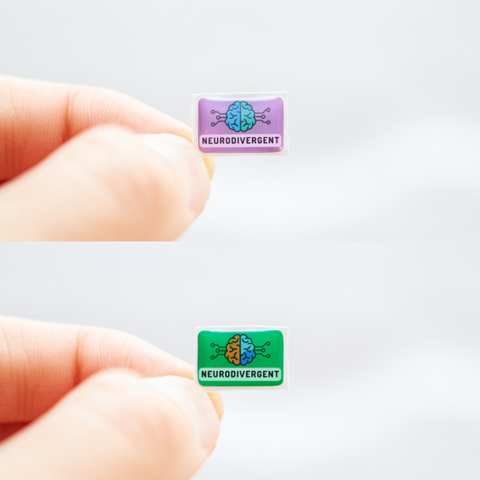 Fingers holding a green sticker and a lavender sticker, both with 'Neurodivergent' text, and a digitally illustrated image of a brain, representing neurodivergent stickers.