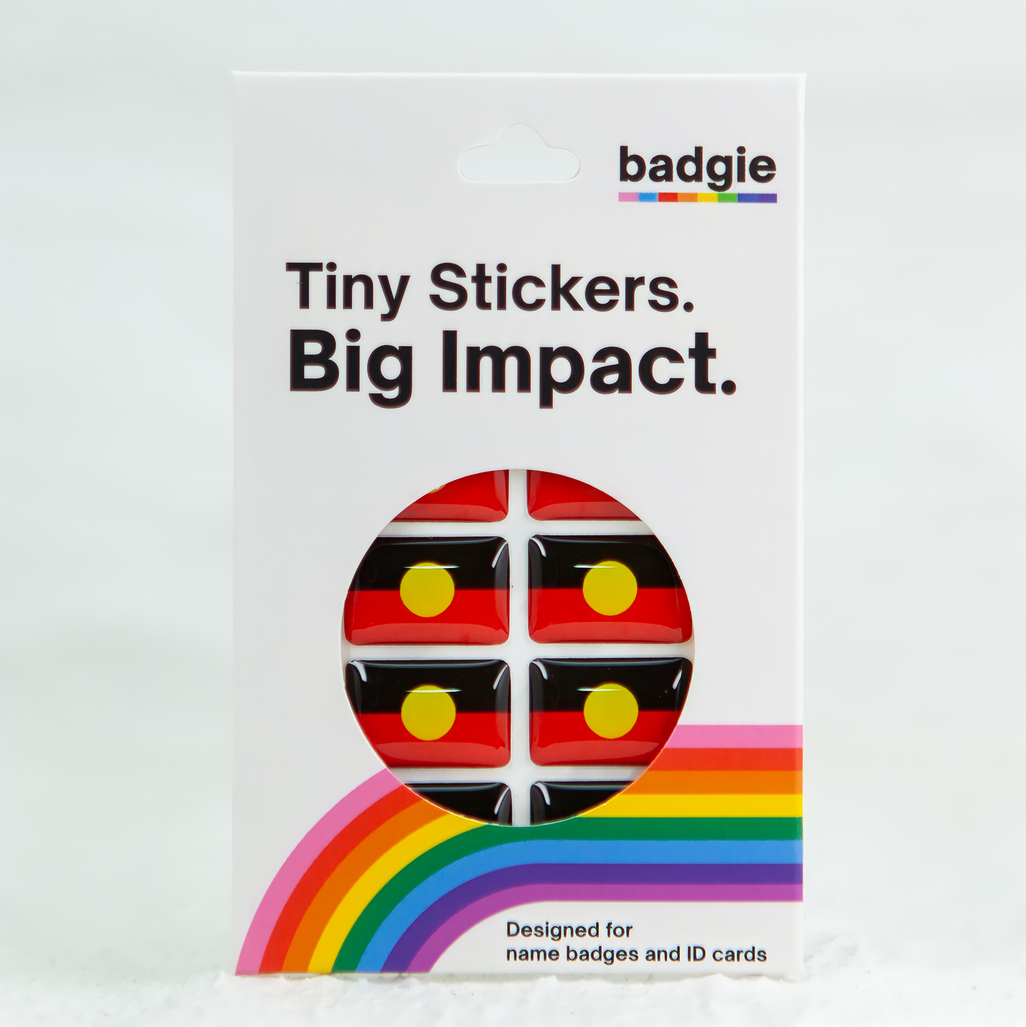Badgie Aboriginal Flag Sticker. Always Was Always Will Be Aboriginal Land - Bright, durable sticker designed for name badges and ID tags, supporting Aboriginal and Torres Strait Islander peoples. 4 Pack of stickers in retail packaging.