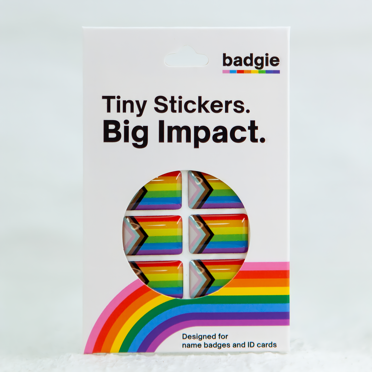 A Progress Pride Flag sticker designed for name badges and ID tags, representing the LGBTQIA+ community. A high-quality, durable gay pride LGBT sticker for inclusivity.