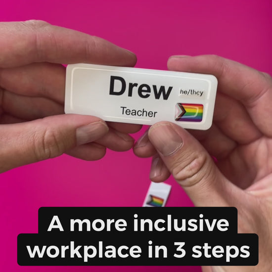 A Progress Pride Flag sticker designed for name badges and ID tags, representing the LGBTQIA+ community. A high-quality, durable gay pride LGBT sticker for inclusivity. Video showing its application to a name badge ID tag.