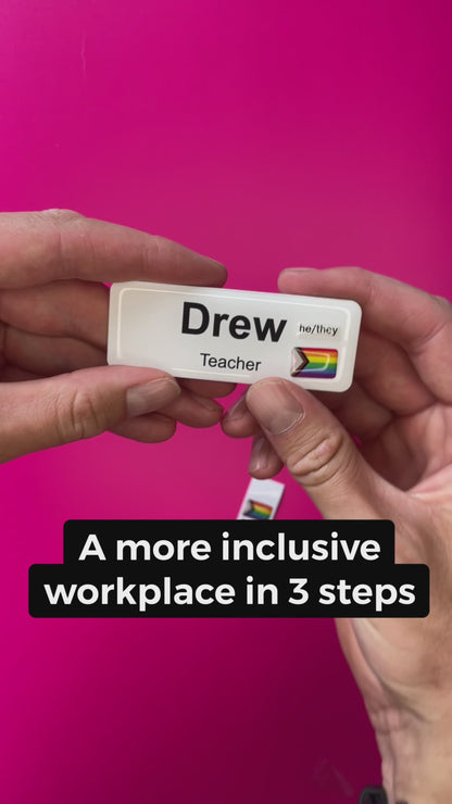 A Progress Pride Flag sticker designed for name badges and ID tags, representing the LGBTQIA+ community. A high-quality, durable gay pride LGBT sticker for inclusivity. Video showing its application to a name badge ID tag.