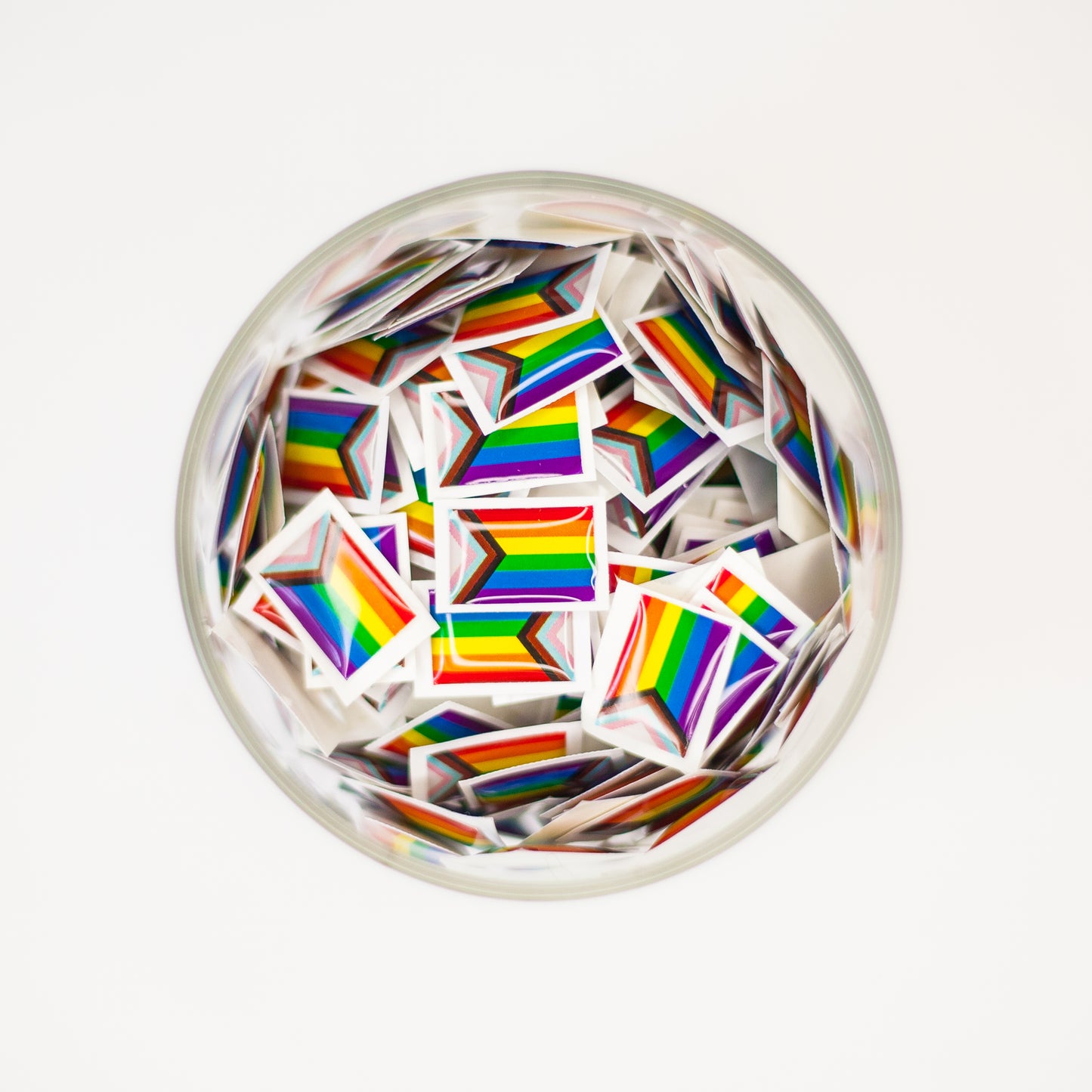 A Progress Pride Flag sticker designed for name badges and ID tags, representing the LGBTQIA+ community. A high-quality, durable gay pride LGBT sticker for inclusivity.