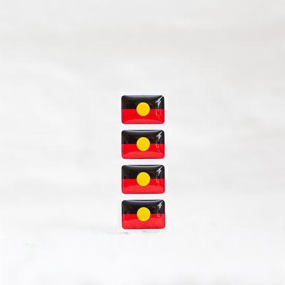 Badgie Aboriginal Flag Sticker. Always Was Always Will Be Aboriginal Land - Bright, durable sticker designed for name badges and ID tags, supporting Aboriginal and Torres Strait Islander peoples. Four stickers.